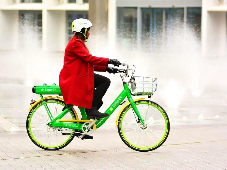 Easy E-Biking - woman riding city Lime e-bike, helping to make electric biking practical and fun