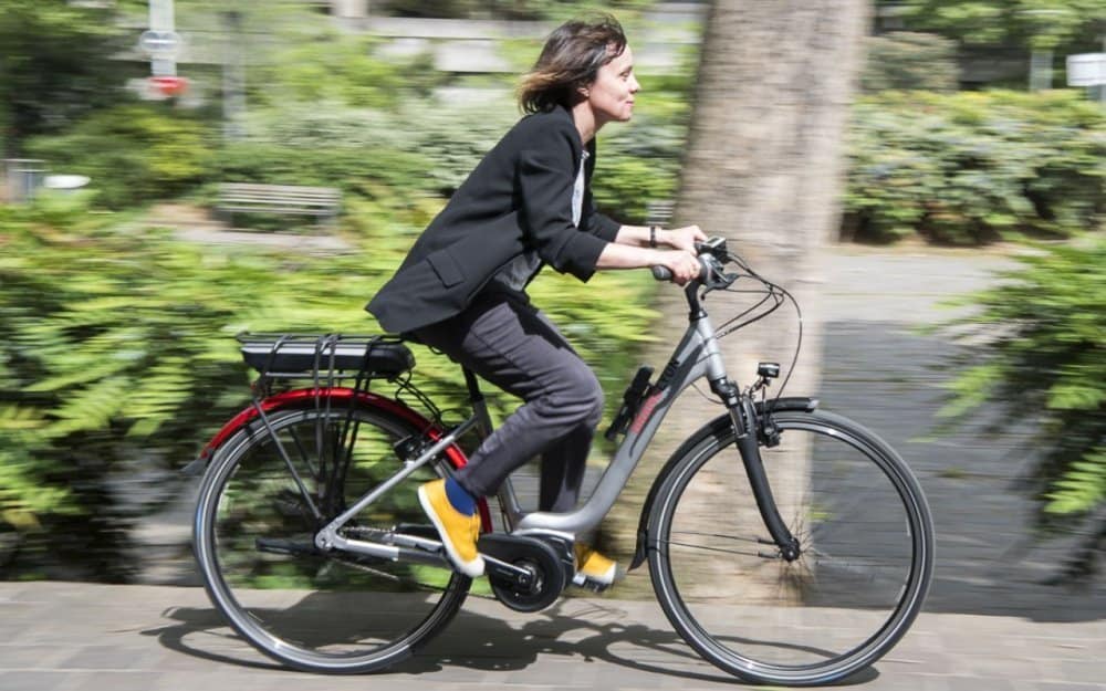 Easy E-Biking - woman riding city e-bike, helping to make electric biking practical and fun